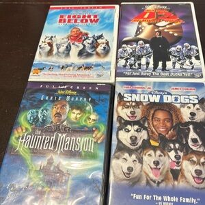 Set of 4 Disney DVD movies- the haunted mansion, Eight Below, Snow dogs, D3